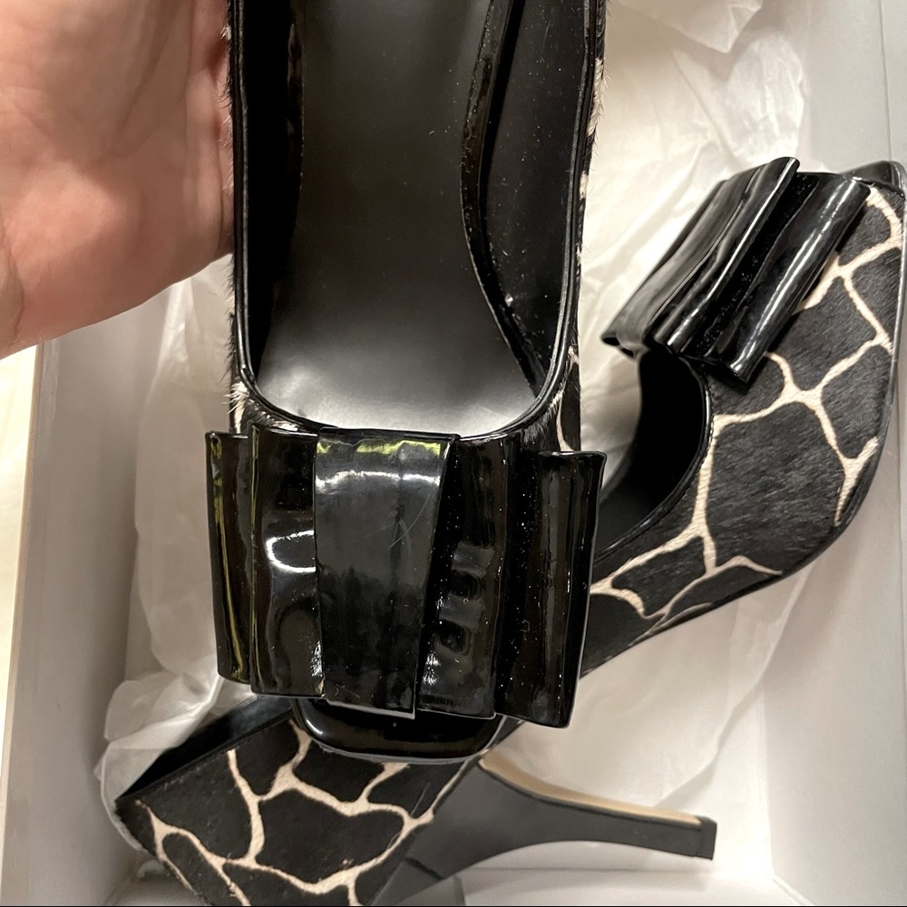 Calf hair and patent leather spike heals